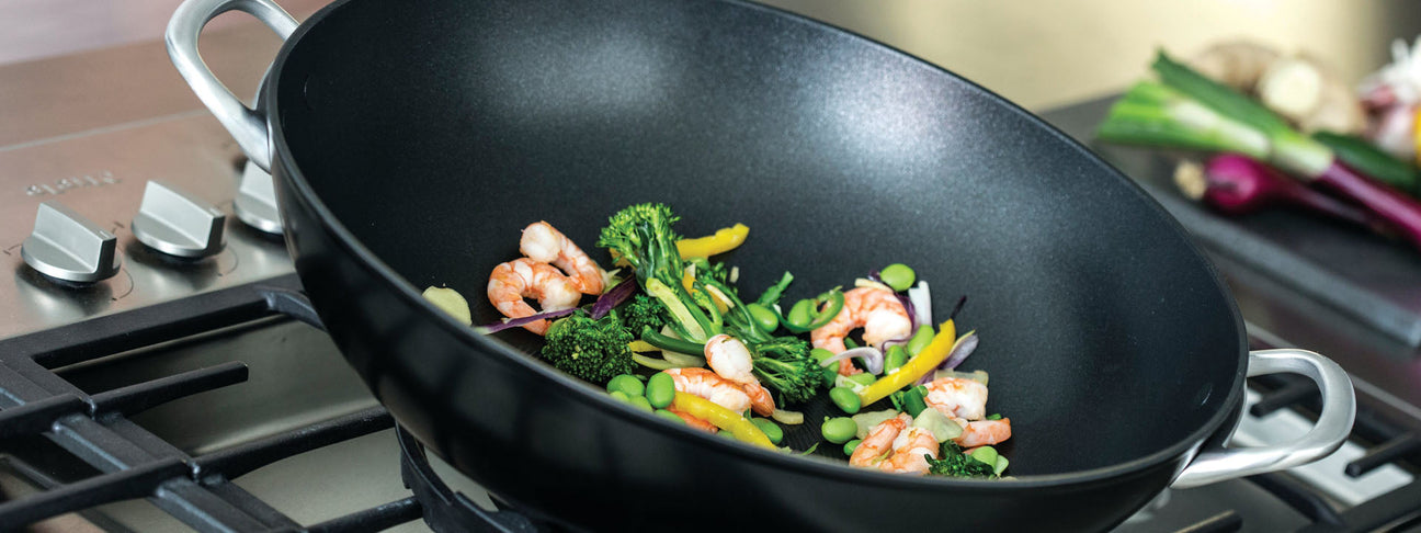 Wok with stir fries prawns and vegetables