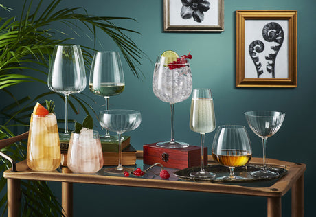 Cocktail glasses on a br